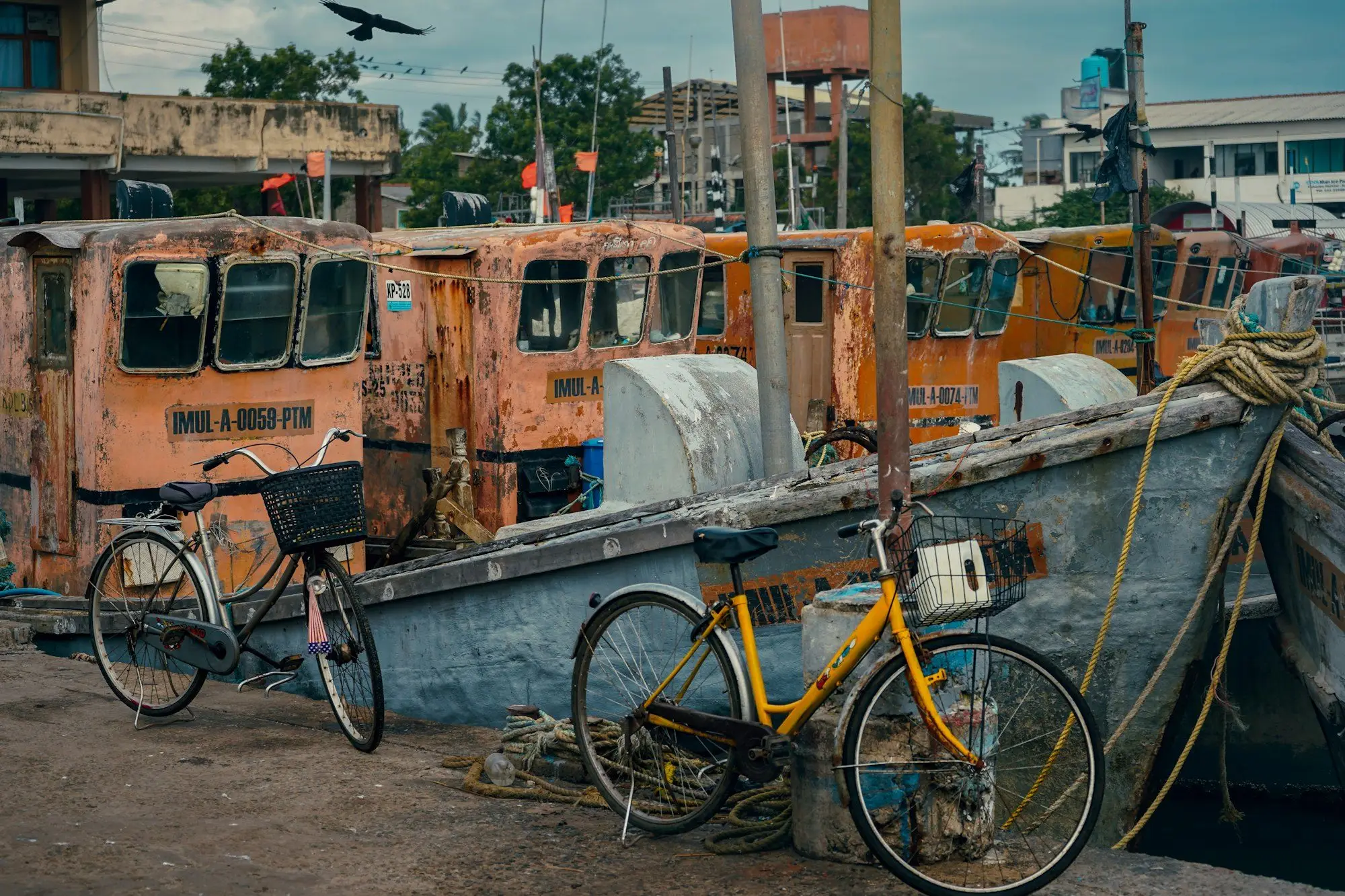 Bicycles and fishing boats at a Kalpitiya harbour